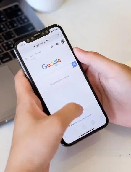 User searching on Google using a mobile phone