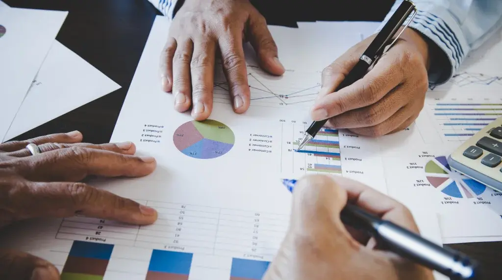 SEO experts reviewing website performance reports and analytics charts